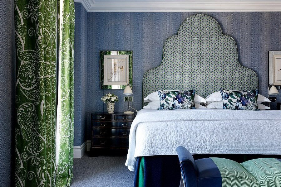 Photo of a hotel room at Charlotte Street Hotel featuring a comfortable double and early 20th century décor in a blue and green color scheme.