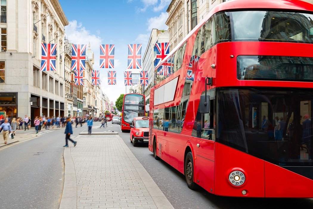 Photo of red busses on Oxford Street in London